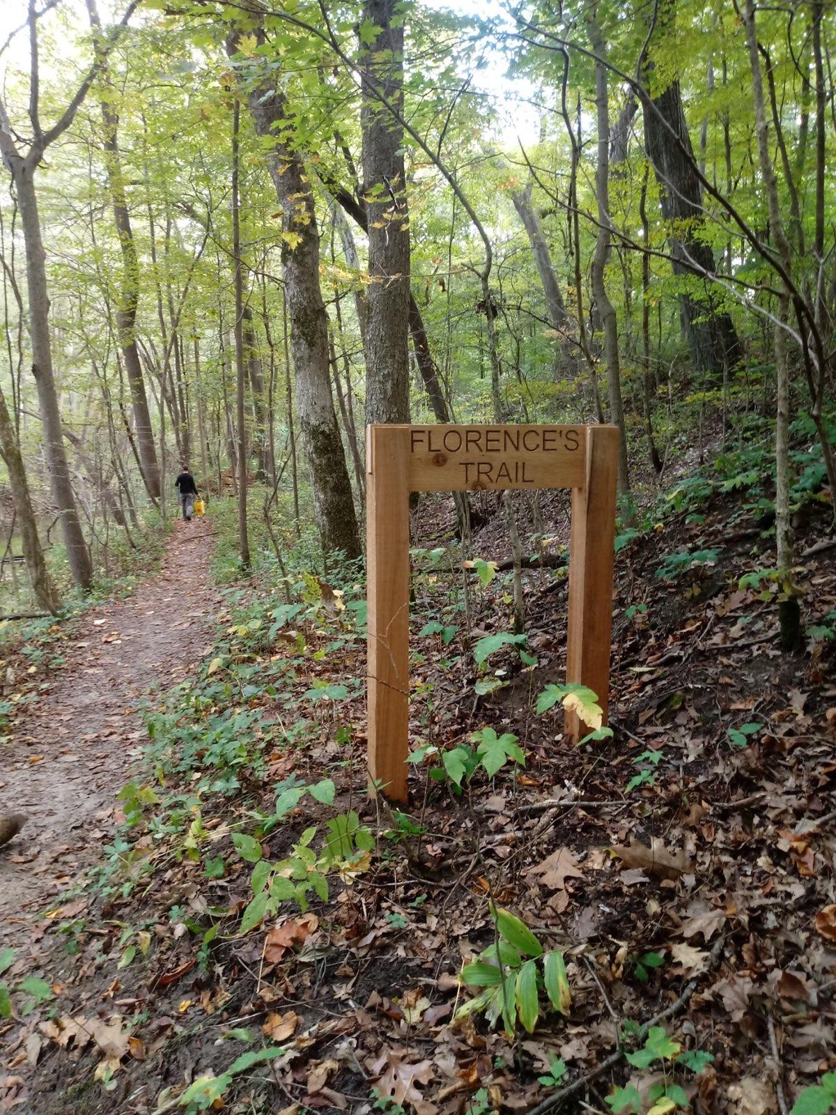 Old wooden sign that reads, "Florence's Trail" at Bicentennial Woods.